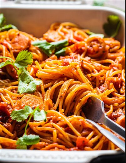 IFFCO premium spaghetti pasta served with savory sausages and rich tomato sauce, ideal for quick Italian recipes.